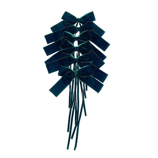 Dark Green velvet bows with ribbon string on a white background
