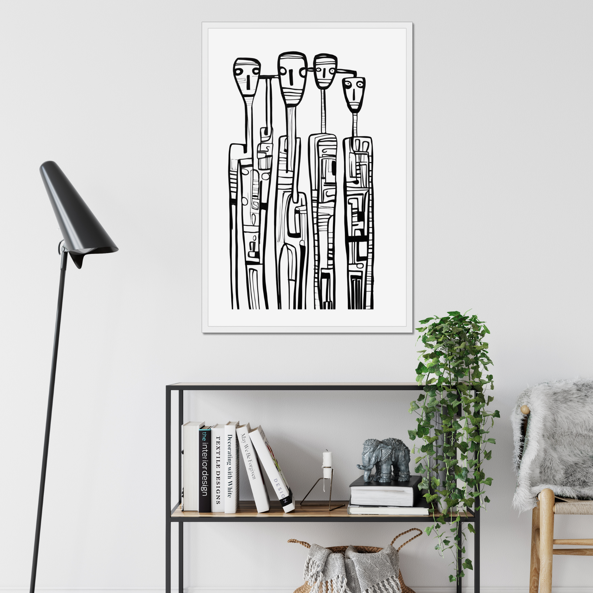 Framed black and white abstract art on a wall above a bookshelf.