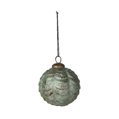 A textured, distressed green glass Christmas ornament with a copper-colored cap and a black hanging string, shown against a plain white background.