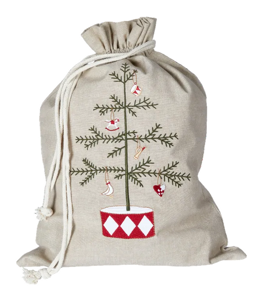 A beige linen Christmas stocking bag with a drawstring closure, featuring an embroidered pine tree with red and white ornaments and a red-and-white diamond-patterned pot.