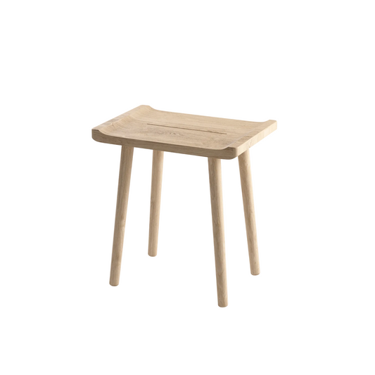 A light natural wood stool with a curved seat and four tapered legs, shown on a plain white background.
