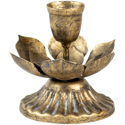 Nordic-inspired lotus flower candleholder styled on a natural linen table.