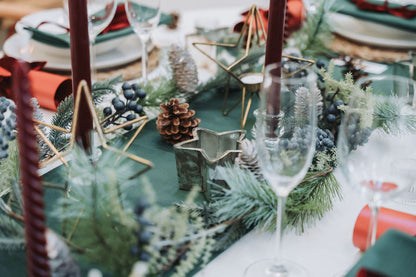 Close-up of copper tealight holder with perforated star design glowing warmly.