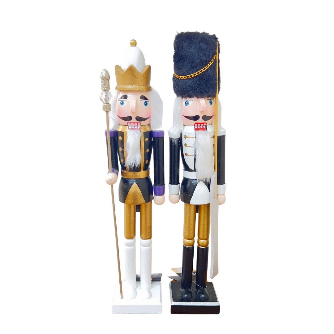 Elegant black and gold nutcracker soldiers with regal white details.