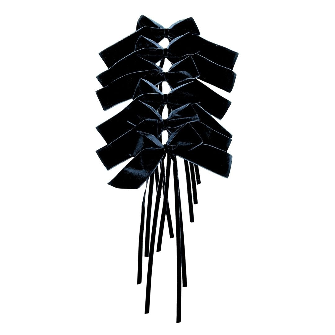 Black velvet bow for table decor on a white background