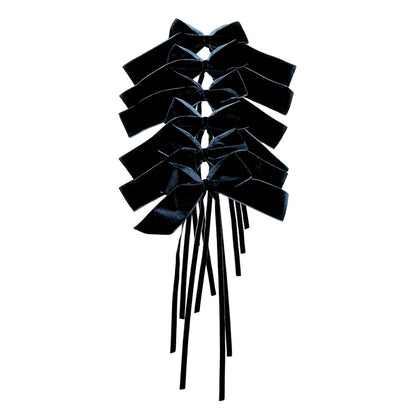 Black velvet bow for table decor on a white background