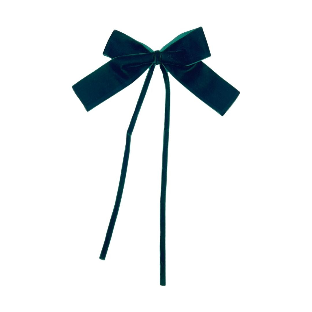 Dark green velvet bow on a white background